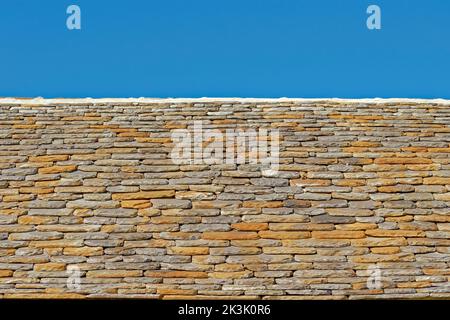 Flat stone roof tiles. Stock Photo