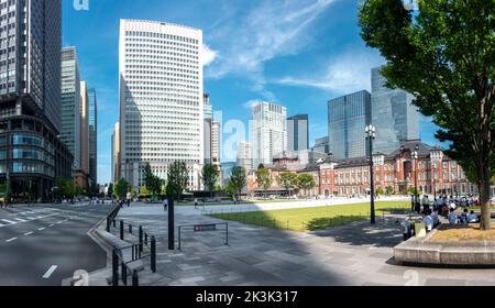 Tokyo, Japan - 09.14.2022: Tokyo Station and its surroundings. Historical Tokyo station building and modern skyscrapers around it on a beautiful day Stock Photo