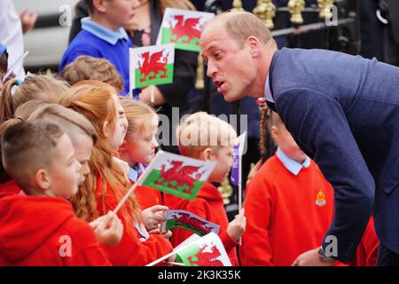 The Prince of Wales speaks to school children as he arrives for a visit to St Thomas Church, in Swansea, Wales. Picture date: Tuesday September 27, 2022.