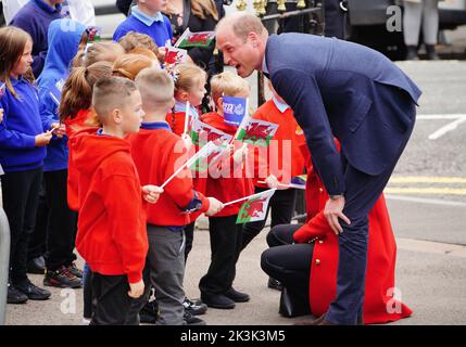 The Prince of Wales speaks to school children as he arrives for a visit to St Thomas Church, in Swansea, Wales. Picture date: Tuesday September 27, 2022.
