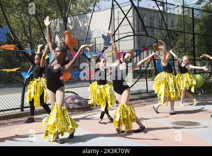 School age modern dancers with Cynthia King Dance School perform at a school multicultural festival in Brooklyn, New York. Stock Photo