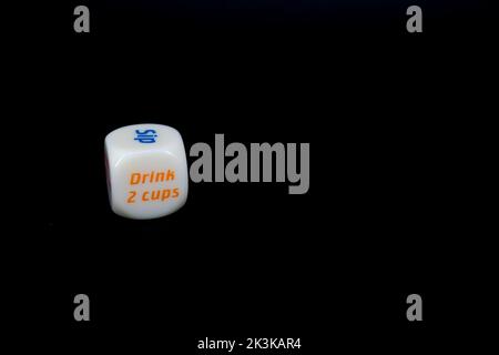 Drinking dice game isolated on black background Stock Photo