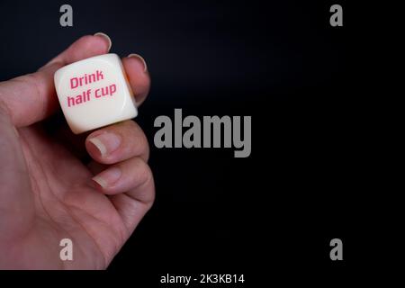 Drinking dice game isolated on black background Stock Photo