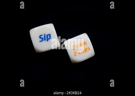 Drinking dice game isolated on black background Stock Photo