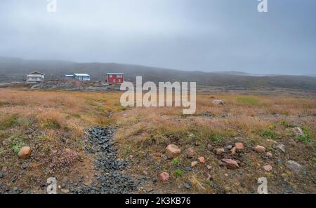 Houses at Apex, Nunavut in the fog of the Arctic Ocean Stock Photo