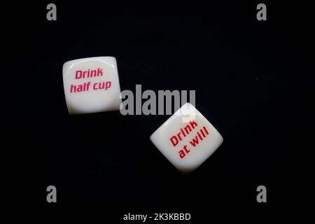Drinking dice game isolated on black background Stock Photo