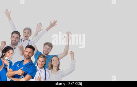 Group of happy smiling doctors raising their arms on gray background with copy space for text Stock Photo