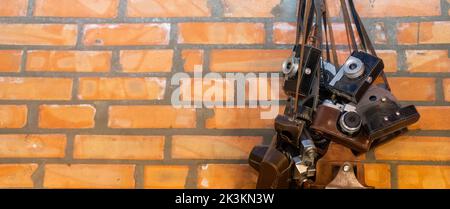 Retro vintage style camera on a old brick wall. Stock Photo