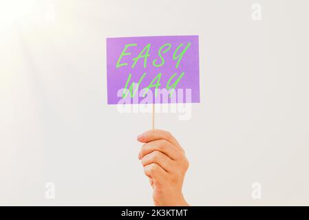 Conceptual caption Easy Way. Business overview making hard decision between two less and more effort method Stock Photo