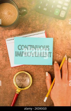 Hand writing sign Continuous Improvement. Business overview Ongoing Effort to Advance Never ending changes Stock Photo