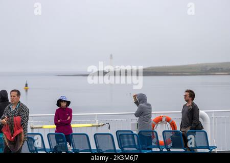 Passengers and view of Hoy High Lighthouse from the NorthLink Ferries ,  isle of Graemsay  Orkney, Scotland, UK Stock Photo