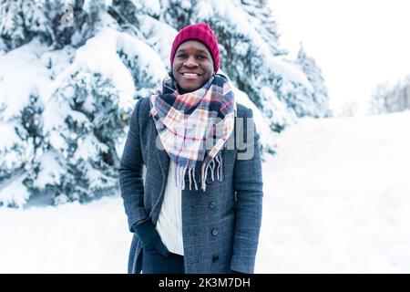 Handsome man in snow posing for camera Stock Photo - Alamy