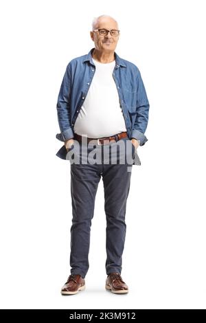 Full length portrait of a mature man with glasses posing with hands in pockets isolated on white background Stock Photo