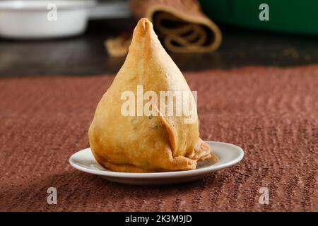detail shot of a indian food singara on plate Stock Photo