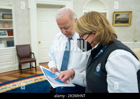 Washington, United States. 27th Sep, 2022. U.S. President Joe Biden, discusses Hurricane Ian with FEMA administrator Deanne Criswell, right, in the Oval Office of the White House, September 27, 2022, in Washington, DC Credit: Adam Schultz/White House Photo/Alamy Live News Stock Photo