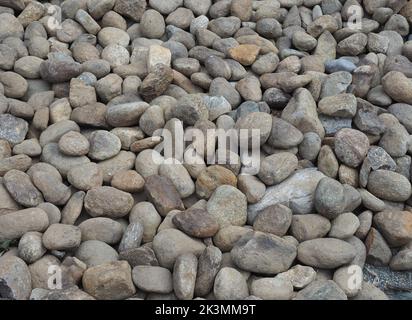 grey cobblestone texture useful as a background Stock Photo