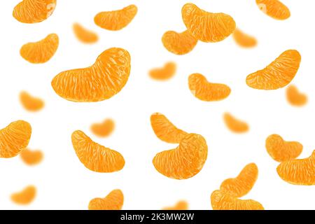 Falling Mandarin lobule isolated on white background, selective focus Stock Photo