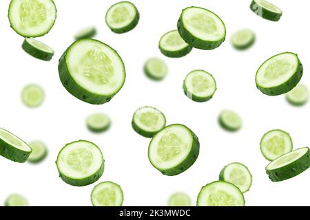 Falling cucumber slice isolated on white background, selective focus Stock Photo
