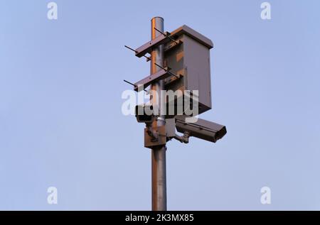 Multi-angle CCTV on pillar 360 degree system background blast cipping path. Stock Photo