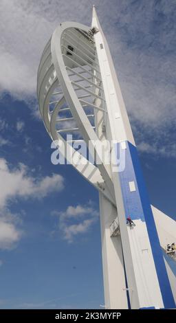 High roller Irina Gola has been making a splash with several thousands of litres of paint while she carries out a towering job with a difference – turning the tallest building outside London from white to blue and gold.     Irina is part of an army of painters drafted in to transform the 560ft high Spinnaker Tower in Port  smouth into the colours of new sponsors, Emirates Airlines.     The colouring has been the subject of controversy because the airline’s colours are gold and red and the tower was to have been painted red and gold until an online protest petition gathered 10,000 signatures. E Stock Photo