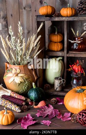 An autumn still life arrangement against a wooden background. Stock Photo