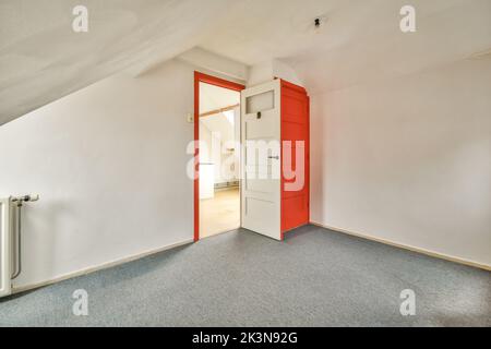 Interior of empty white room without windows with curtains and greyish floor Stock Photo