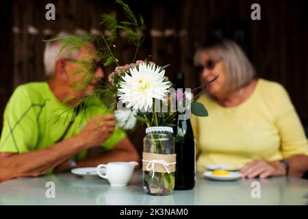 retired couple on a date having coffee together in a cafe Stock Photo