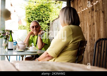retired couple on a date having coffee together at a cafe Stock Photo