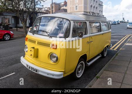 Yellow Volkswagen Campervan parked in Llandudno, North Wales, UK. Stock Photo