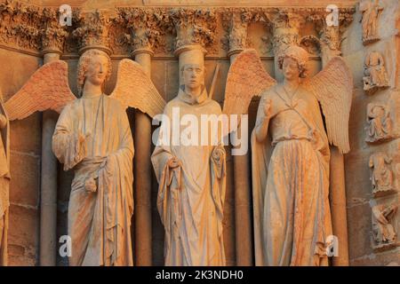 The Smiling Angel (Smile of Reims), carved between 1236-1245, on the north portal of the west facade of Reims Cathedral (Marne), France Stock Photo