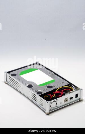 A vertical shot of an external HDD drive isolated on white background Stock Photo