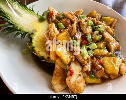 Close up shot of chicken pineapple bowl with a fresh cut pineapple bowl Stock Photo