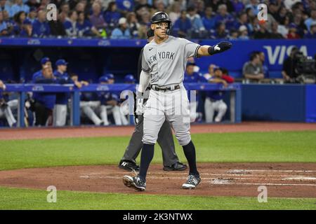 Cleveland Indians Jose Ramirez stands next to New York Yankees Aaron Judge  who puts his thumb down when he reacts after driving in 2 runs with a  double in the 3rd inning