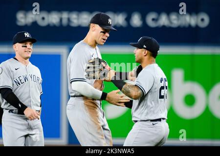 Toronto, Canada, September 27, 2022, New York Yankees' Aaron Judge (99) celebrates with Gleyber Torres (25) after defeating the Toronto Blue Jays in MLB baseball action, in Toronto on Tuesday, September 27, 2022. THE CANADIAN PRESS/Christopher Katsarov Stock Photo