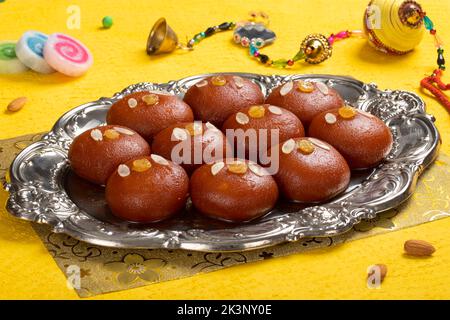 Gulab jamun is a milk-solid-based sweet dumpling popular in India, pakistan in festivals like Diwali, eid or even wedding parties Stock Photo
