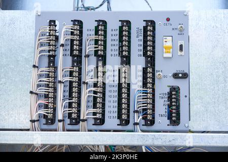 Electric control panel. The wires are connected to residual current circuit breakers and voltage monitoring relays. High quality photo Stock Photo