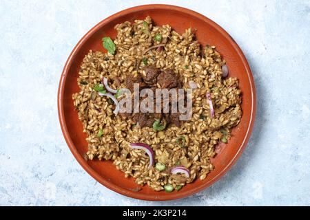 Puffed rice in pink paper. Traditional Popular bangle and Indian evening park snacks. ingredients mixture are chanachur, peanut, mint, green chili, sa Stock Photo