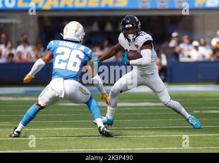 Jacksonville Jaguars wide receiver Charles Sharon (17) holds on for a  second-half touchdown over Atlanta Falcons safety Omare Lowe (26) during  NFL preseason football play at the Georgia Dome in Atlanta Thursday