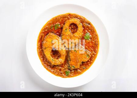 Ruhu rui or Katla  Fish curry, traditional bangali fish curry ,arranged in a white ceramic bowl garnished with fresh red chilly and curry leaves on a Stock Photo