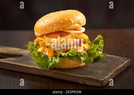 fresh tasty burger isolated on black texture background Stock Photo