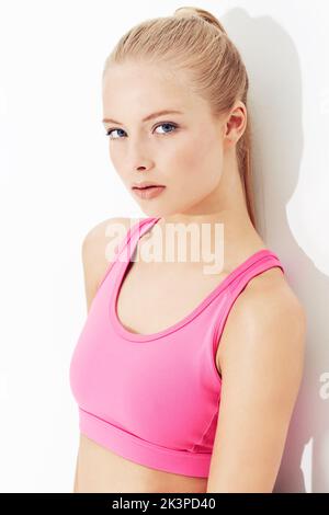Fashion and workouts go hand in hand. A young woman posing in sportswear. Stock Photo