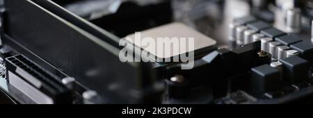 Tiny silver detail in computer processor, computer motherboard with all component Stock Photo