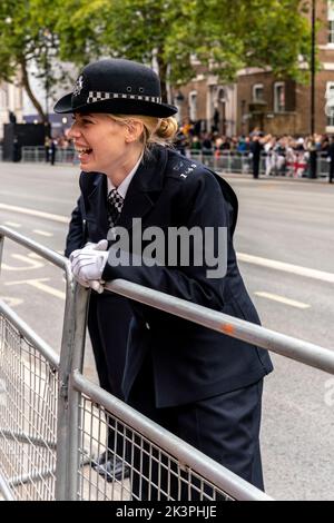 A Laughing Uk Female Police Officer, Whitehall, London, Uk Stock Photo