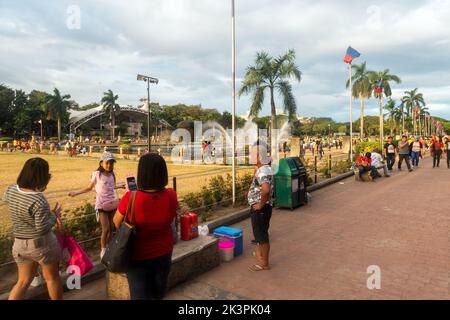 Manila, Philippines - People enjoying a sunny day at Rizal Park Stock Photo