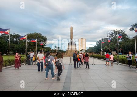 Manila, Philippines - People enjoying a sunny day at Rizal Park Stock Photo