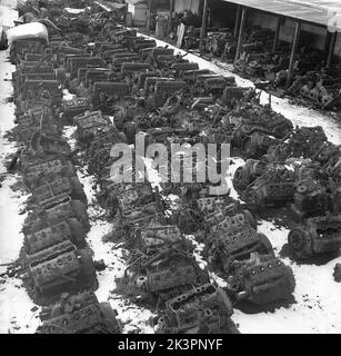 In the 1940s. A scrapyard where parts and engines of disused cars and vehicles are visible. The picture taken during the time of World War II and the recycling was important to reuse the material in the industries supplying the swedish army with weaponry and vehicles. Stockholm Sweden 1942. Kristoffersson ref AF18-3 Stock Photo