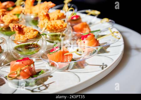 Set of various small appetizers on a buffet table Stock Photo