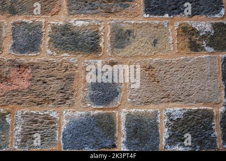 Natural old stone wall texture background with large stones Stock Photo