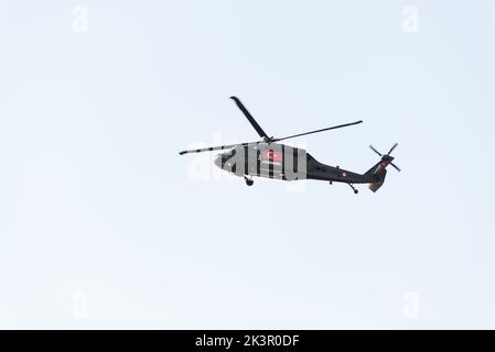 Izmir, Turkey - September 9, 2022: Close up shot of a Turkish gendarme helicopter on the sky on the liberty day of Izmir at Izmir Konak Turkey Stock Photo