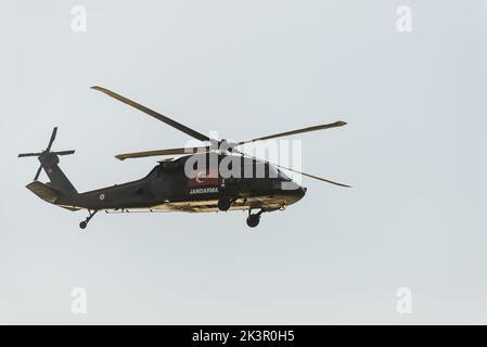 Izmir, Turkey - September 9, 2022: Close up shot of a Turkish gendarme helicopter on the sky on the liberty day of Izmir at Izmir Konak Turkey Stock Photo